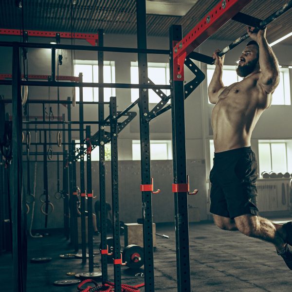 4 Fitness Pro: Demonstrating upper body strength with pull-ups, an effective exercise for building a strong and toned physique.